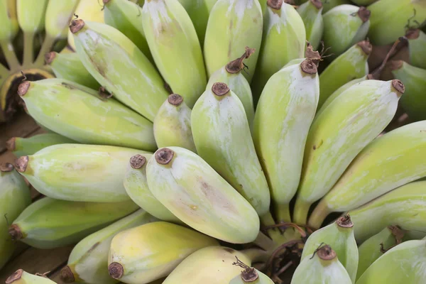 Banana on wood table : raw banana