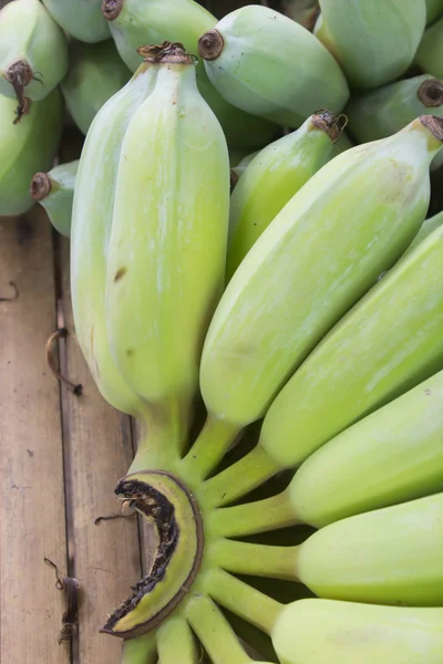 Banana on wood table : raw banana