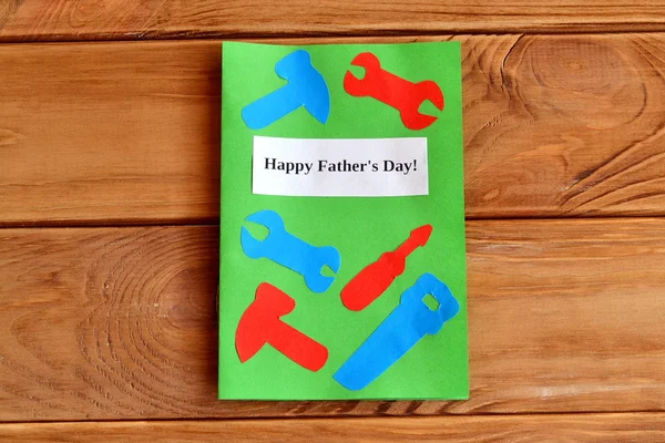 Happy father\'s day. Greeting card with paper tools. Kids paper diy idea. Father\'s day gift idea. Wooden background