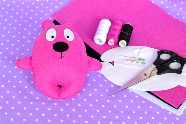 Pink felt Teddy bear, handmade felted toy. Scissors, needle, thread, pins, paper templates - sewing kit