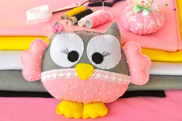 Felt owl toy, pincushion, sewing kit, scissors. Sewing concept