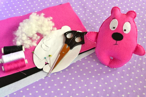 Pink felt Teddy bear, handmade toy. Scissors, needle, thread, pins, paper templates - sewing kit