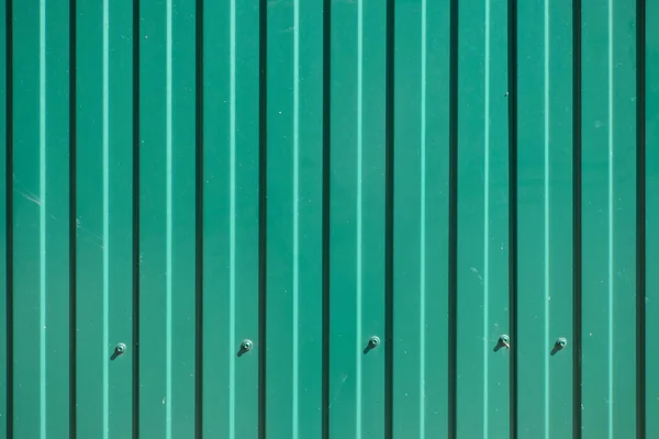 Green goffered metal texture with screw heads