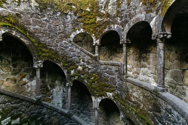 Initiation Wells in Sintra. Old spiral staircase with columns on the territory of the Quinta da Regaleira.