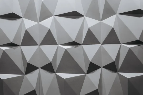 Abstract wallpaper or geometrical background consisting of black and white geometric shapes: triangles and polygons