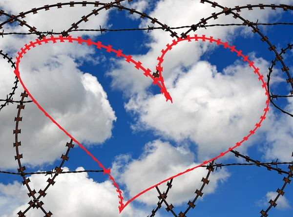 Barb wire heart on sky background