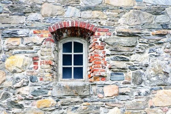 Old window and stone wall