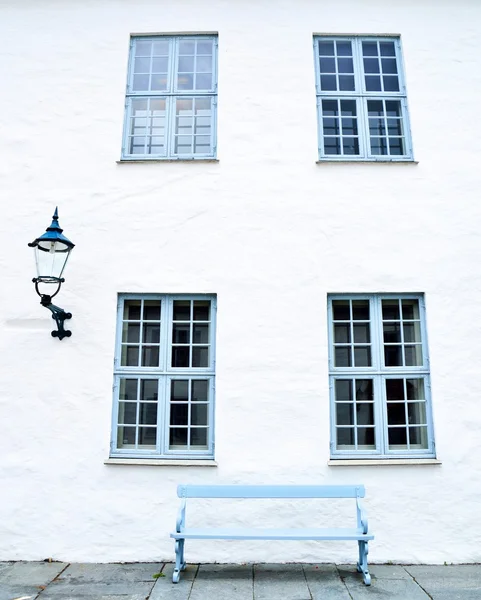 Blue windows, a blue bench and a streetlight