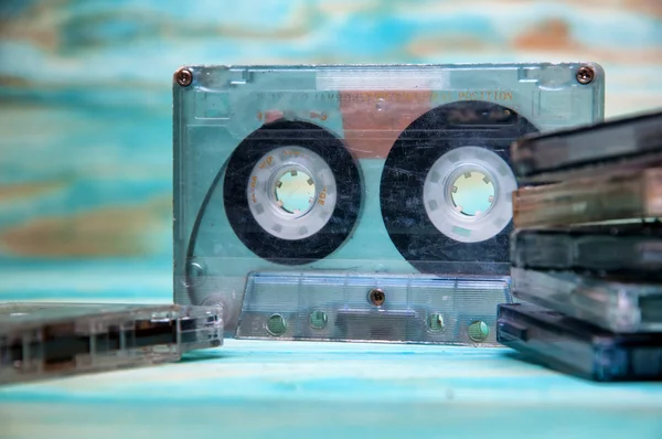 Old music audio tapes on blue background