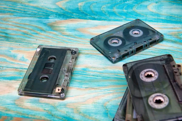 Old music audio tapes on blue background