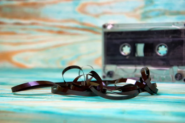 Old music audio tape on blue background