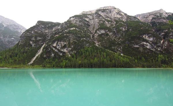 Mountain lake and mountain face in the alps (dolomites)