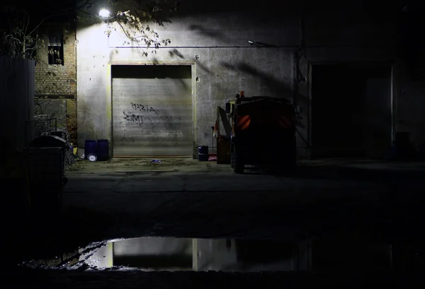 View on a garage and vehicle by night