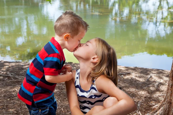 Little Brother Kisses Sister On Lips