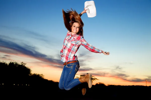 Jumping Teenage Cowgirl