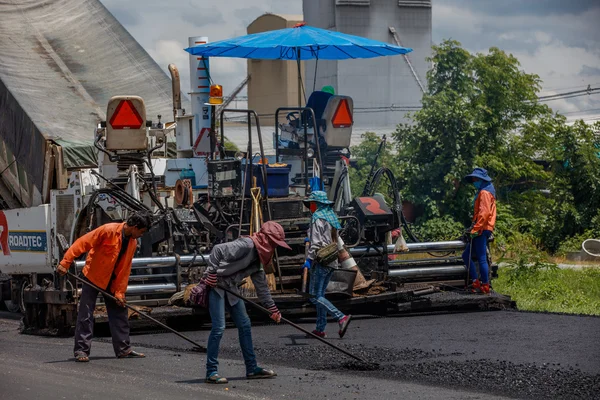 Bangkok, Thailand, June 16 2016: construction worker building street in thailand