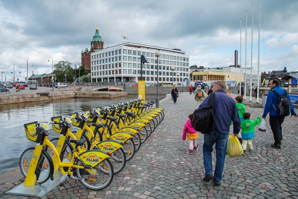 Finland, Helsinki, August 30, 2016. People go to the Sea Port of Helsinki by bike intended for rent