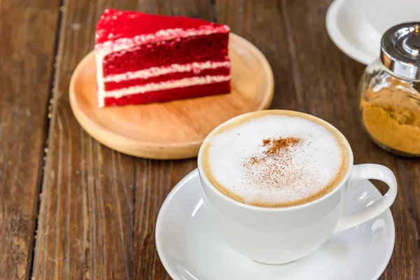 A cup of  coffee and cake.