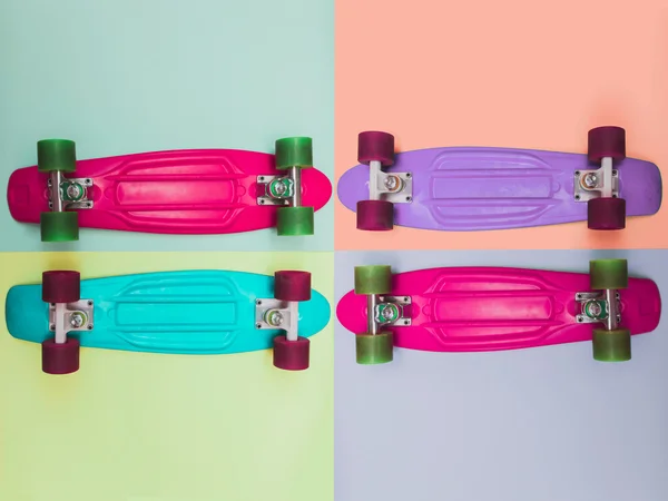 Four skateboards with contrast background