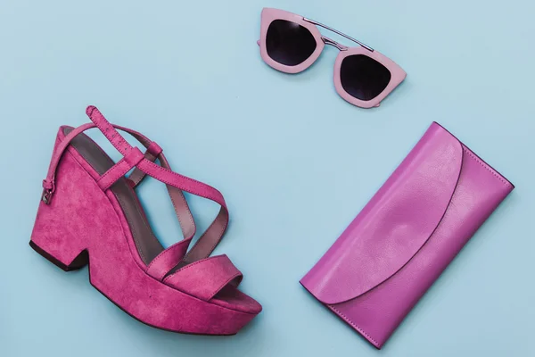 Shoes with sunglasses and purse