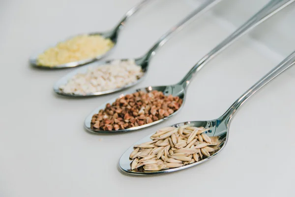 Cereals in metallic spoons
