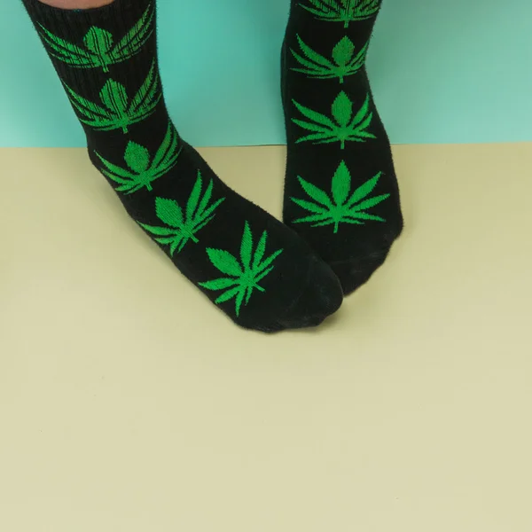 Legs in weed print socks