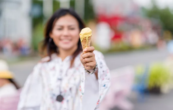 Photos of Asian women eating ice cream