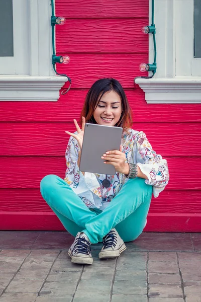 Photos of Asian woman looking at the iPad