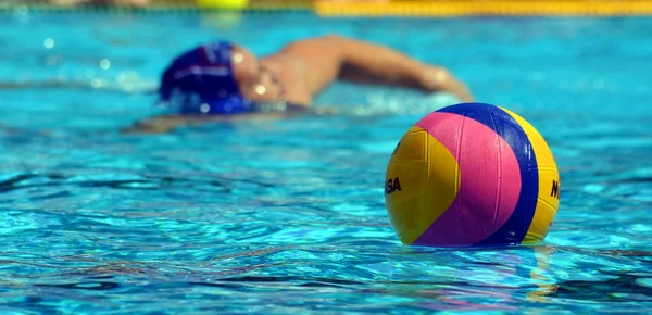 Focus on the waterpolo ball and player in the background.