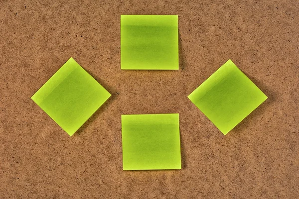 Yellow-green blank paper stickers on the old fibrous cardboard