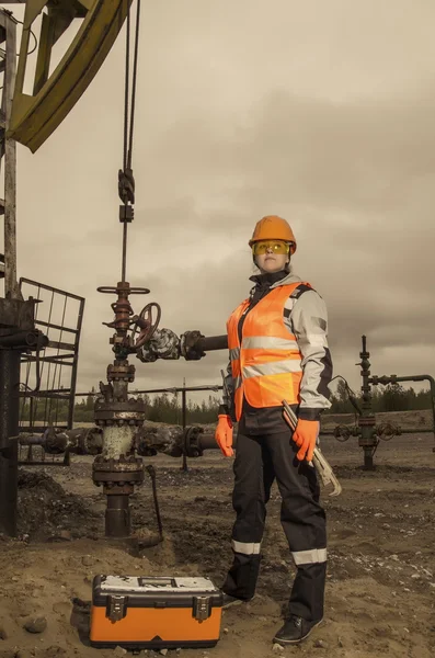 Woman engineer in the oil field