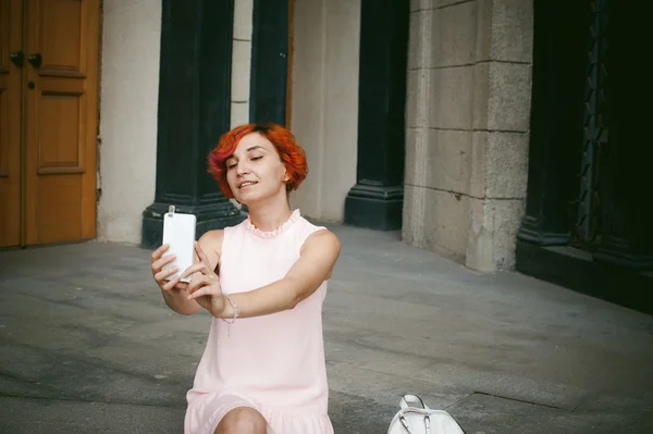 Portrait of a girl doing selfie.