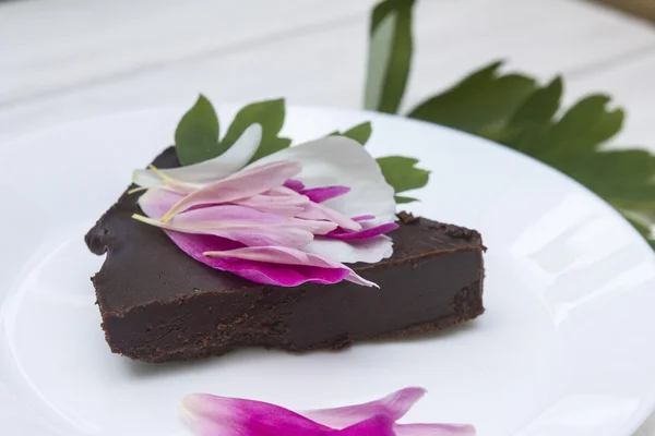Sweet italian chocolate cake with fresh flowers