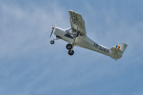 Recreational flying airplane with smoke on air show demonstration flight. \