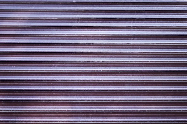 Background texture of scuffed shop shutters