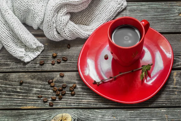 Red coffee Cup on a plate beautiful wooden background