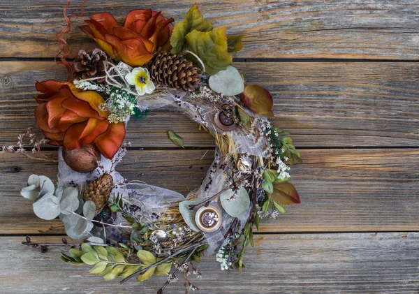 Autumn wreath on wooden background in the form of a circle