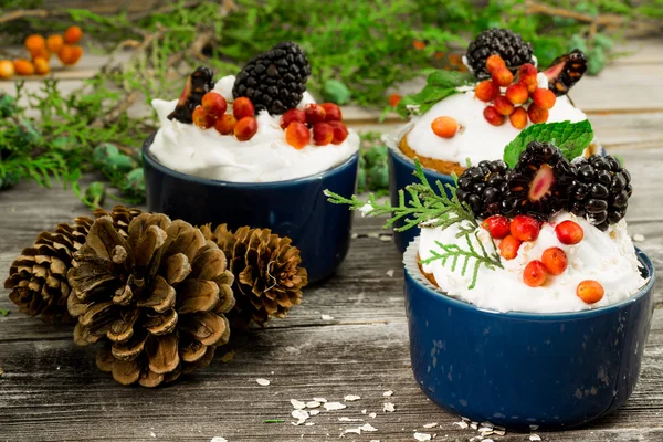 Beautiful Christmas cupcake with cream and berry