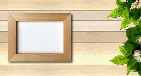 Simple photo frame on wood background