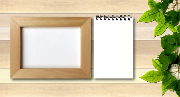 Simple photo frame on wood background