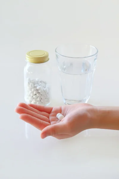 Hands and water with a medicine