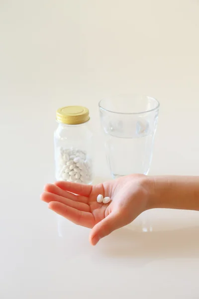Hands and water with a medicine