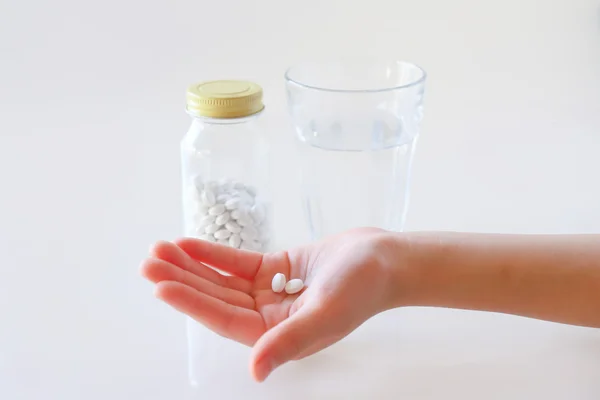 Hands and water with a medicine