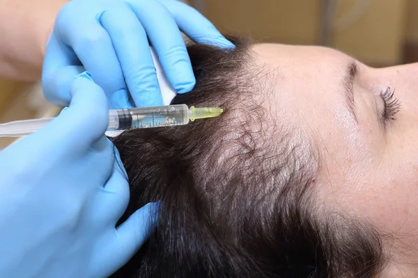 Anti hair loss injection in clinic.