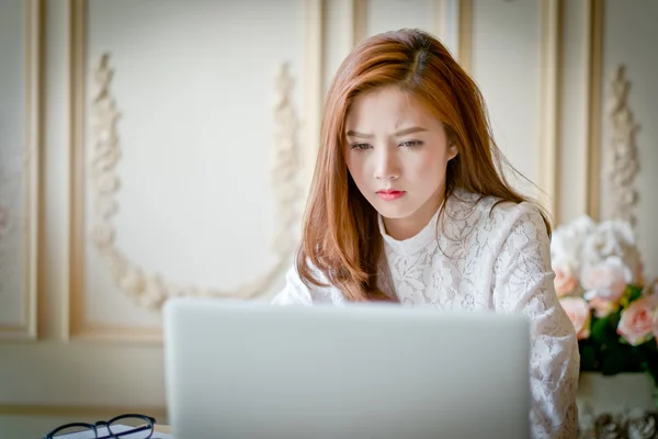 Woman  with laptop watching  drama movie on computer