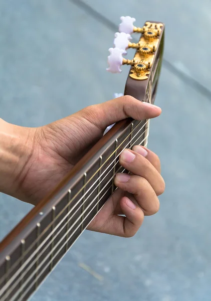 hand playing on  guitar