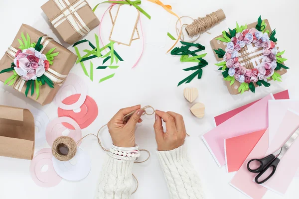 Preparation for the holiday. Packaging of gifts in bright paper.