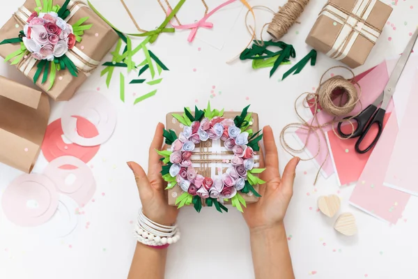 Preparation for the holiday. Packaging of gifts in bright paper.