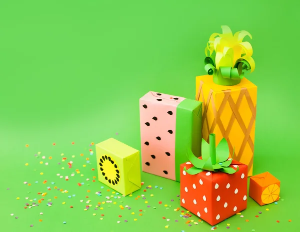 Gifts wrapped in colored paper. Gifts like fruit. Fruit boxes.