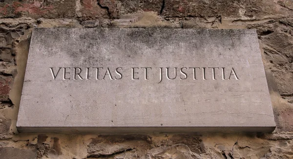 Veritas et Justitia. A Latin phrase meaning truth and Justice. Engraved text.